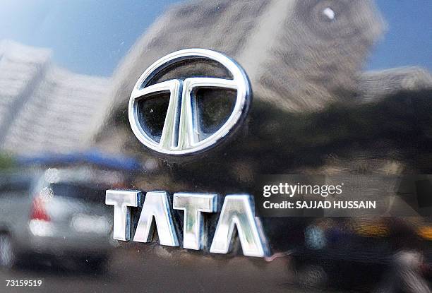 The Tata logo shines on the boot of a car reflecting high-rise buildings of south Mumbai's business district, 31 January 2007. India's Tata Steel...