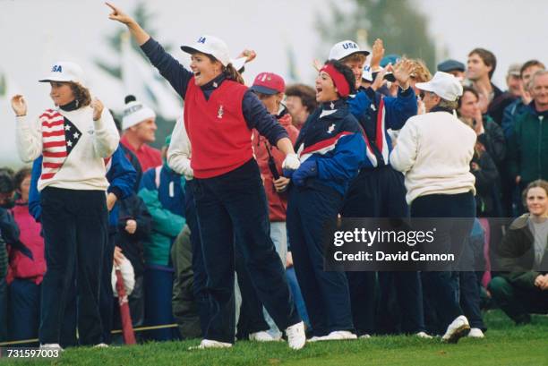 American golfer Meg Mallon and her team mates celebrate a win at the Solheim Cup golf tournament at Dalmahoy Country Club, Edinburgh, Scotland,...