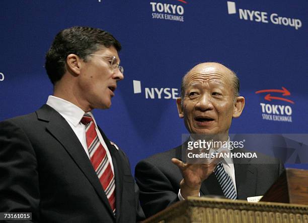 New York, UNITED STATES: NYSE Group, Inc. CEO John A. Thain speaks with Tokyo Stock Exchange, Inc. President & CEO Taizo Nishimuro just before...