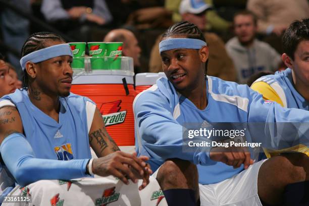 Allen Iverson and Carmelo Anthony of the Denver Nuggets talk while sitting on the bench during the NBA game against the Memphis Grizzlies at the...