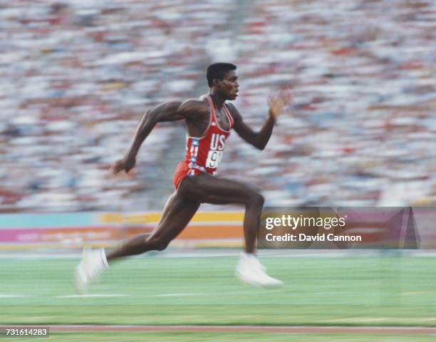 American athlete Carl Lewis accelerates down the runway as he competes in the Men's Long Jump event at the XXIII Olympic Summer Games at the Los...