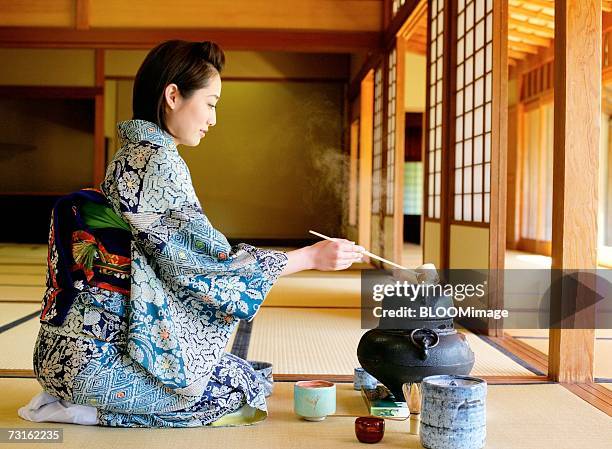 japanese woman sitting in tea room - tea ceremony stock pictures, royalty-free photos & images