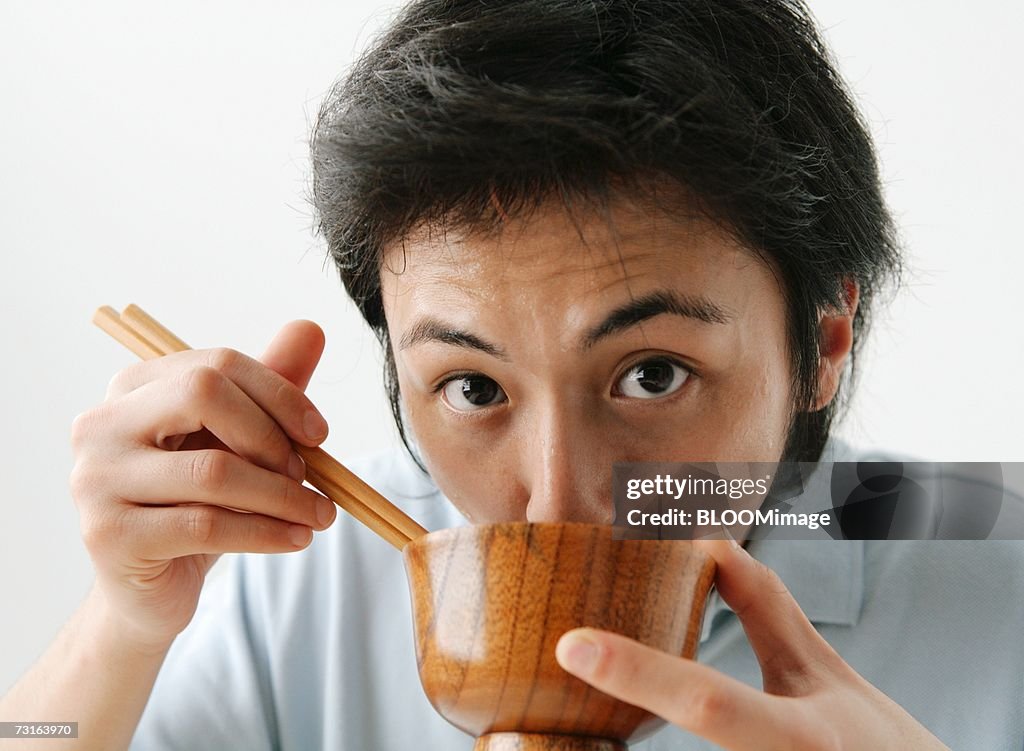 Man eating miso soup