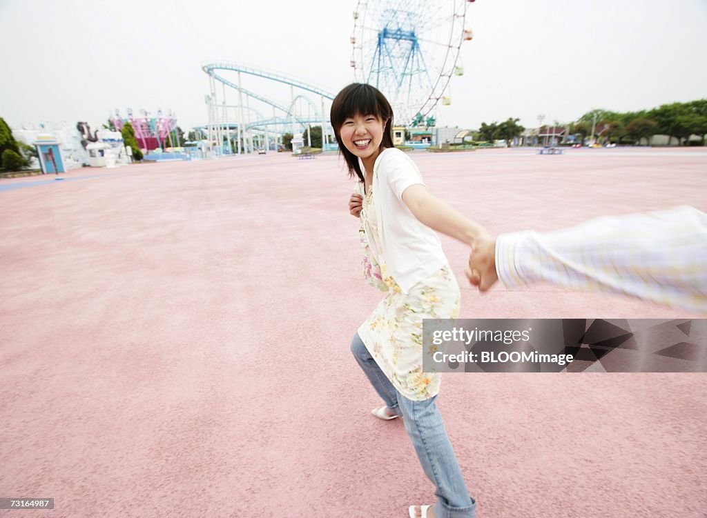 Young couple playing in the amusement park