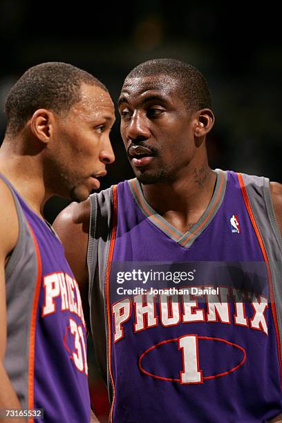 Amare Stoudemire of the Phoenix Suns talks with his teammate Shawn Marion during the game against the Milwaukee Bucks on January 26, 2007 at the...