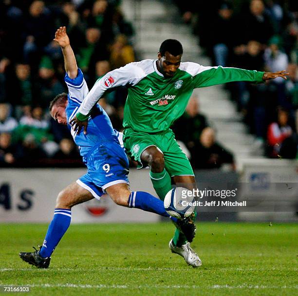 Peter MacDonald of St Johnstone tackles Shelton Martis of Hibernian during the CIS Insurance Cup semi final at Tynecastle Park on January 31, 2007 in...