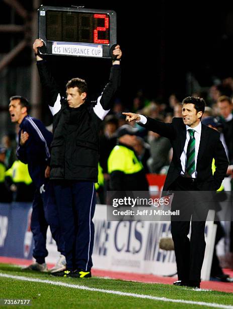 Owen Coyle coach of St Johnstone and John Collins coach of Hibernian shout instructions during the CIS Insurance Cup semi final at Tynecastle Park on...