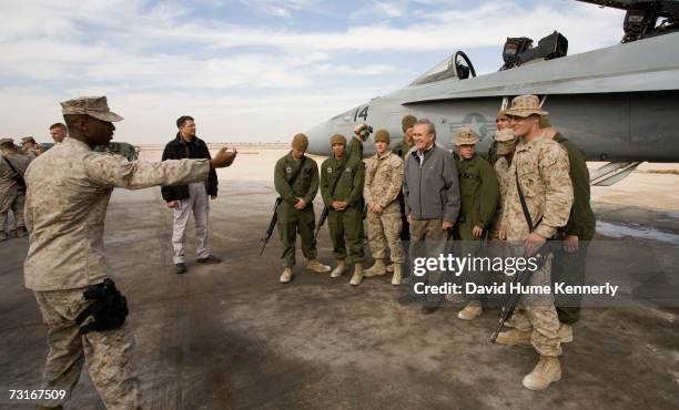 Secretary of Defense Donald Rumsfeld poses for photos during his last visit to Iraq as SECDEF at Al Asad Air Base, Iraq. December 9, 2006. Rumsfeld...
