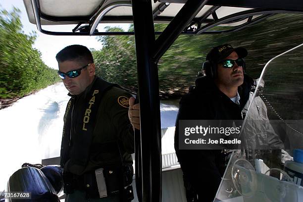 Border Patrol agent Alex Rodriguez and Monroe County Sheriff Marine Unit officer, Nelson Sanchez, ride together as they look for possible boats...