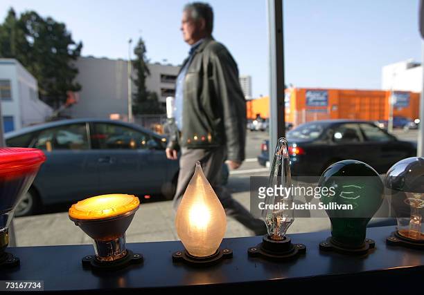 Man walks by a window display of incandescent light bulbs at the City Lights Light Bulb Store January 31, 2007 in San Francisco, California....