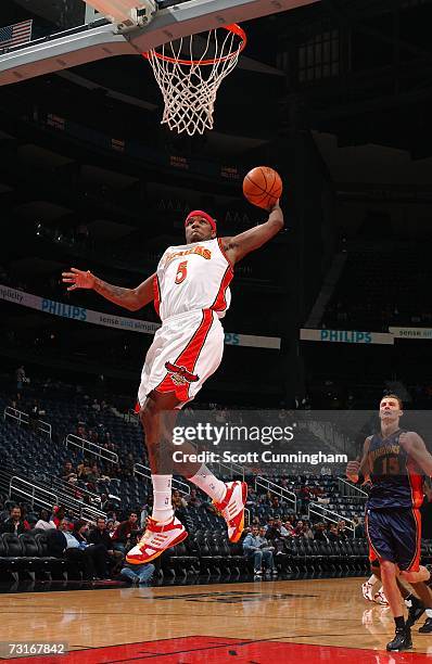 Josh Smith of the Atlanta Hawks goes up for a dunk against the Golden State Warriors at Philips Arena on January 31, 2007 in Atlanta, Georgia. NOTE...