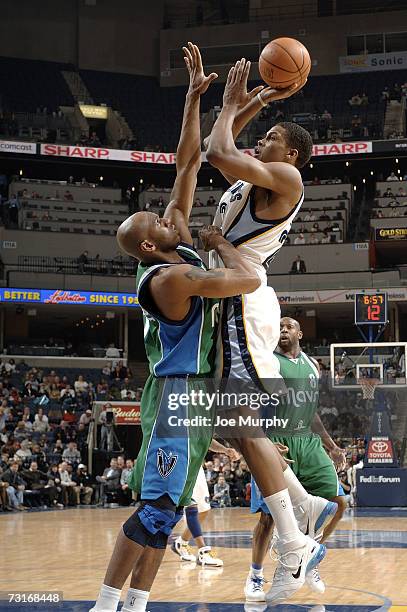 Rudy Gay of the Memphis Grizzlies shoots over Jerry Stackhouse of the Dallas Mavericks on January 31, 2007 at FedExForum in Memphis, Tennessee. NOTE...