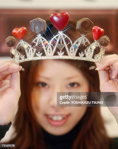 Nami Saeki, a sales clerk of Japan's accesory shop Q-pot shows off a tiara made with assorted chocolate-like jewelleries priced 71,400 yen , at...