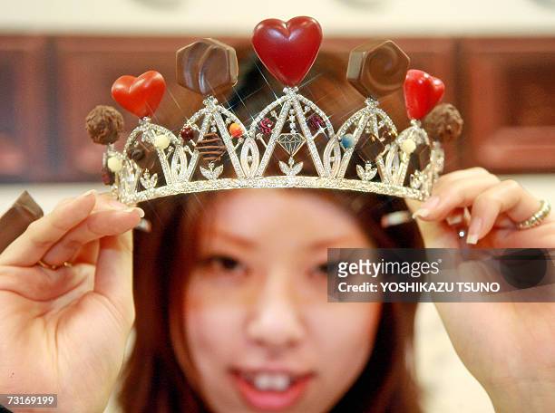 Nami Saeki, a sales clerk of Japan's accesory shop Q-pot shows off a tiara made with assorted chocolate-like jewelleries priced 71,400 yen , at...