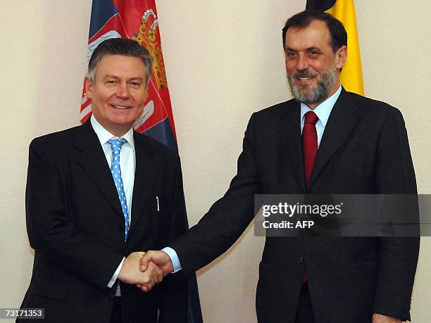 Serbian Foreign Minister Vuk Draskovic welcomes his Belgian counterpart Karel De Gucht prior their meeting in Belgrade, 01 February 2007. AFP PHOTO /...