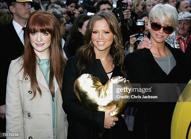 Singers Nicola Roberts, Kimberley Walsh and Sarah Harding of band Girls Aloud help launch the Gold Heart Appeal outside Harrods on February 1, 2007...