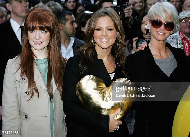 Singers Nicola Roberts, Kimberley Walsh and Sarah Harding of band Girls Aloud help launch the Gold Heart Appeal outside Harrods on February 1, 2007...