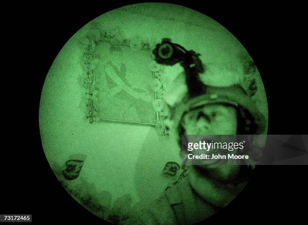 Marine pauses in the living room of an Iraqi home while on a search operation for insurgents in the early hours of February 1, 2007 in Ramadi in...