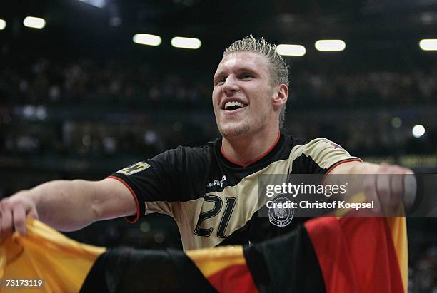 Lars Kaufmann of Germany celebrates the 32-31 victory in the IHF World Championship semi final game between Germany and France at the Cologne Arena...