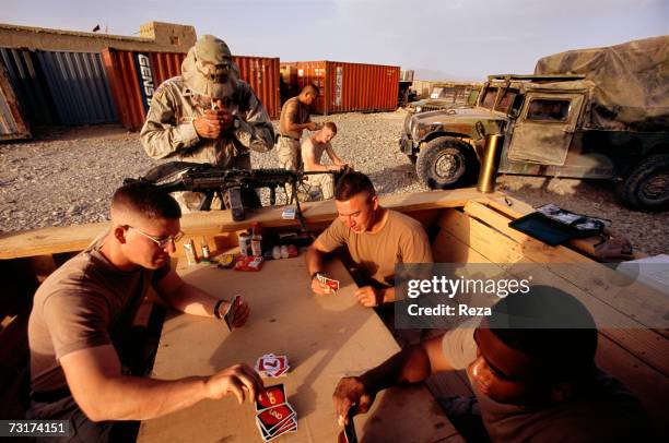 American soldiers playing cards on July, 2004 in Afghanistan.