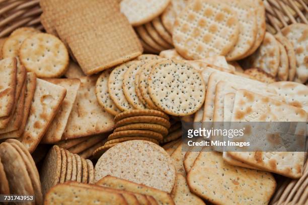 close up of a large selection of cream crackers. - crackers stock pictures, royalty-free photos & images