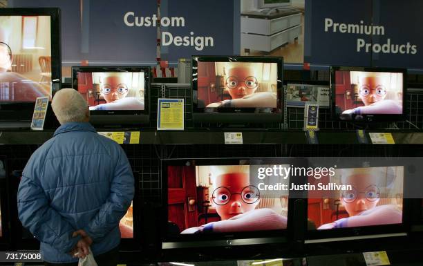 Best Buy customer looks at a display of flat panel televisions at a Best Buy store February 1, 2007 in San Francisco. Football fans have been...