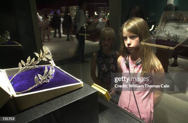 Katie Knowles, of Quarryville, Pa., views the Grosvenor Bridal Tiara, part of the Faberge Collection, on display at the First USA Riverfront Arts...