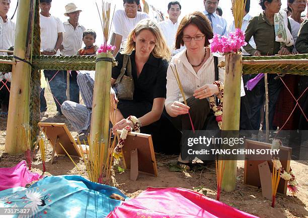 British embassy Vice Consul Julia Shand and Australia embassy secretary Naomi Viccars pray for the three westerners who were killed in 1994 alont the...