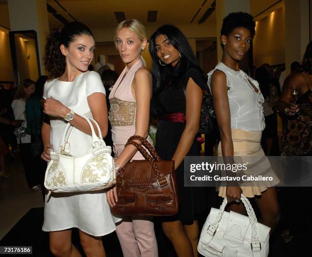 America's Next Top Model's Anchal Joseph poses with merchandise models at the pre-Super Bowl XLI cocktail reception and shopping extravaganza at...