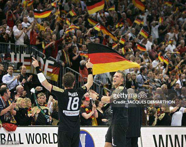 Germany's Michael Kraus and Lars Kaufmann celebrate after the Germany vs France semi-final match of the 2007 Handball World Championship at the Koeln...