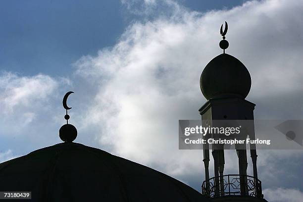 The minaret and dome of the Birmingham Central Mosque dominate the skyline as Muslims arrive for friday prayers on 2 February Birmingham, England....