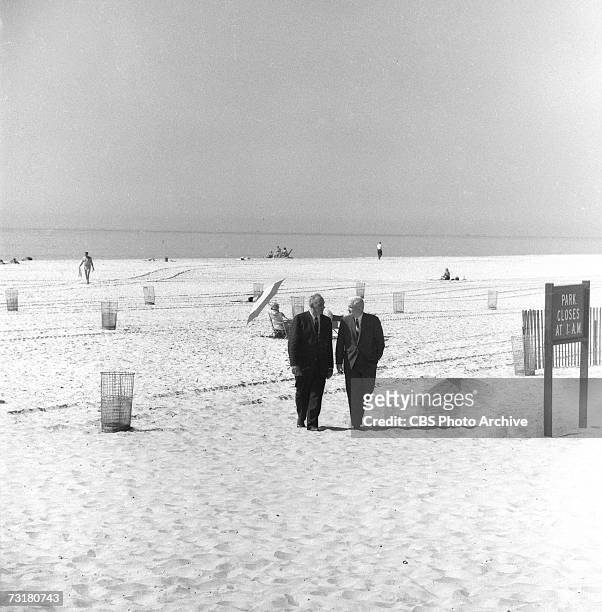 American television journalist and producer Bill Leonard walks on a nearly deserted beach and talks with public official and city planner Robert...