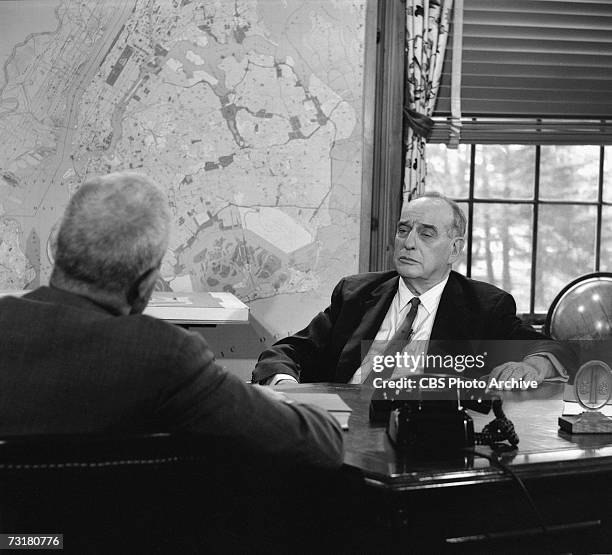 American television journalist and producer Bill Leonard interviews public official and city planner Robert Moses in the latter's office during the...