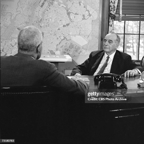 American television journalist and producer Bill Leonard interviews public official and city planner Robert Moses in the latter's office during the...