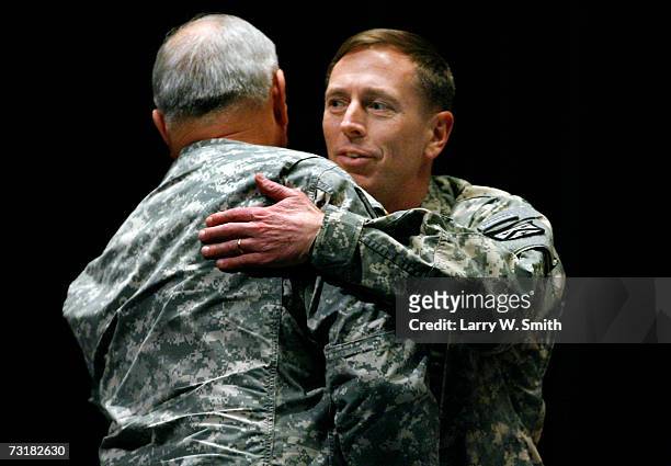 Lieutenant General David H. Petraeus hugs General William S. Wallace during during a departure ceremony held in Petraeus' honor at the Eisenhower...