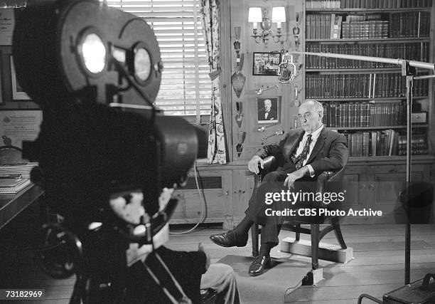 American public official and city planner Robert Moses sits in his office during an interview for 'The Twentieth Century,' a television documentary...