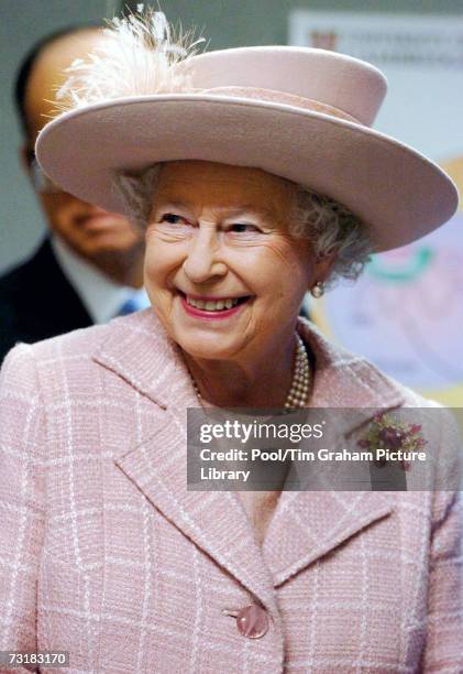 Queen Elizabeth II looks on during a tour of the newly opened Cancer Research UK Cambridge Research Institute at Cambridge University on February 2,...