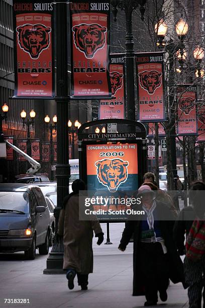 Pedestrians walk past Chicago Bears banners which line many of the streets in the Loop February 2, 2007 in Chicago, Illinois. The Bears will face the...