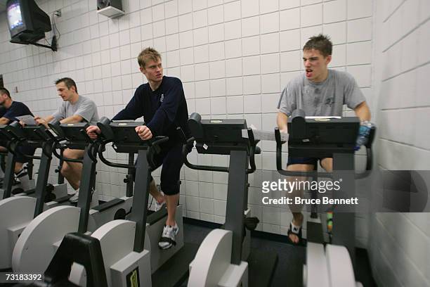 Ville Peltonen and Kamil Krepsof of the Florida Panthers rides the staitonary bike in the locker room before the the NHL game against the Pittsburgh...