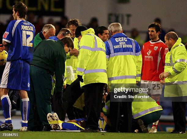Cardiff City defender Kevin Mcnaughton recieves treatment after a serious injury meant that he had to be strechered off the pitch during the Coca...