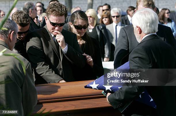 Family and friends weep over the coffin of Capt. Brian Freeman during a memorial service at Ft. Rosecrans National Cemetery on February 2, 2007 in...