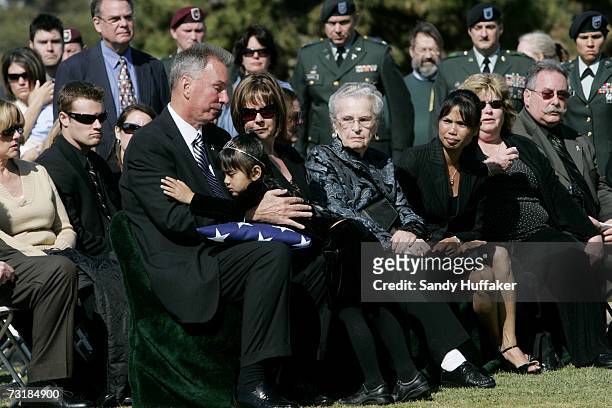 Kiona Lee gives Randy Freeman a hug during a memorial service for his son Capt. Brian Freeman at Ft. Rosecrans National Cemetery on February 2, 2007...