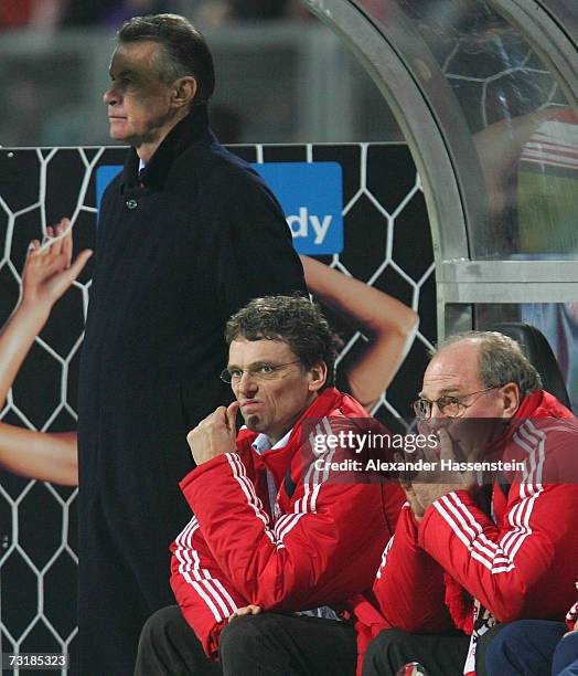 Ottmar Hitzfeld , new head coach of Munich, Michael Henke new assistent coach and Munich?s manager Ulli Hoeness looks on during the Bundesliga match...