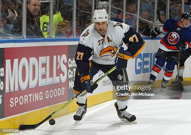 Teppo Numminen of the Buffalo Sabres controls the puck behind the net against the New York Islanders during their game on January 27, 2007 at Nassau...