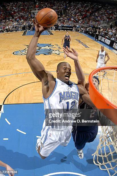Dwight Howard of the Orlando Magic pulls in a rebound against the New Jersey Nets on February 2 at Amway Arena in Orlando, Florida. NOTE TO USER:...