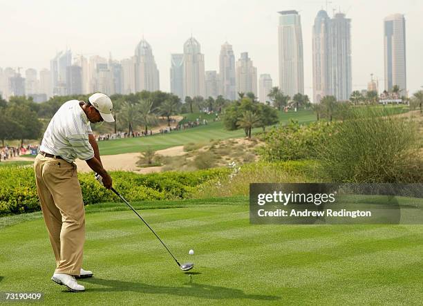 Tiger Woods of USA tees off on the eighth hole during the third round of the Dubai Desert Classic on the Majilis Course at Emirates Golf Club on...