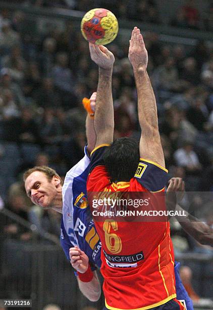 Iceland's Olafur Stefansson scores past Spain's Ruben Garabaya Arenas during the Spain vs Iceland match for 7th place of the 2007 Handball World...