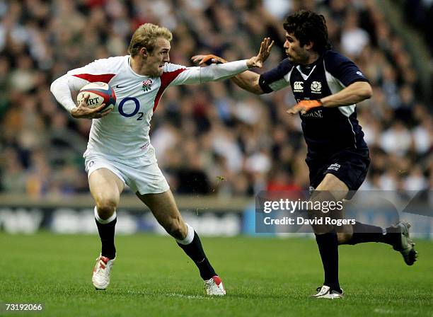 Olly Morgan of England looks to hand off Marcus Di Rollo of Scotland during the RBS Six Nations championship match between England and Scotland at...