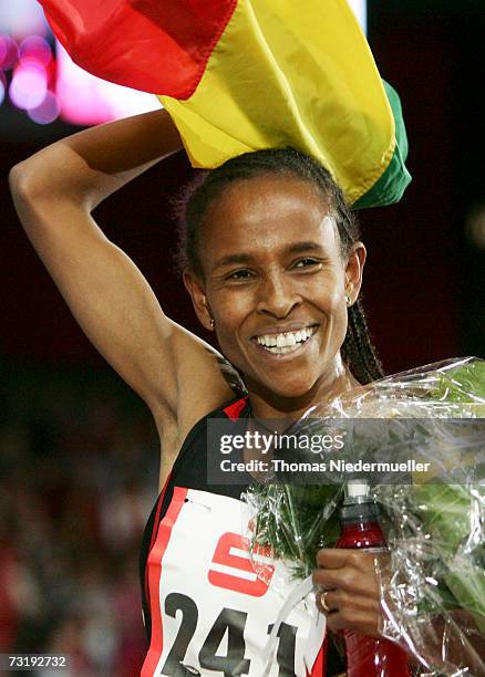 Meseret Defar of Ethiopia celebrates her indoor world record for the 3000m with a time of 8:23.72 during the Sparkassen Cup 2007 at the Hanns-Martin...