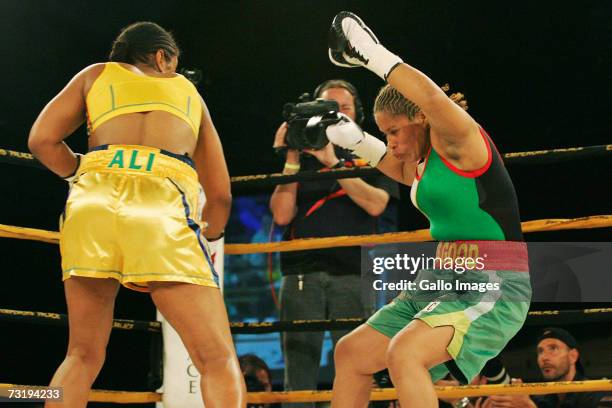 Lalia Ali of the USA knocks down Gwendolyn O'Neil of Guyana during the WBC/WIBA Super Middleweight World Title bout at Emperors Palace February 3,...